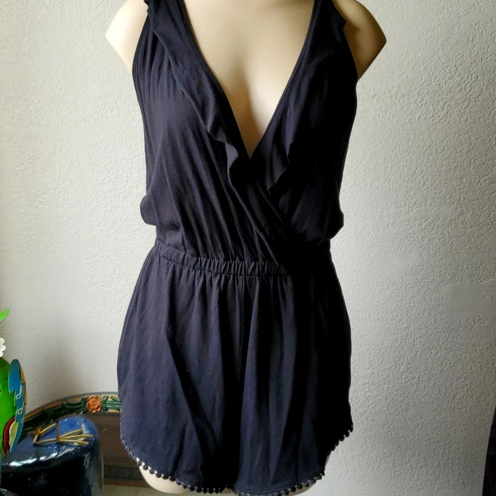 Like new, Romper black with ruffle and trim so cute split up the sides of short - Picture 1 of 7